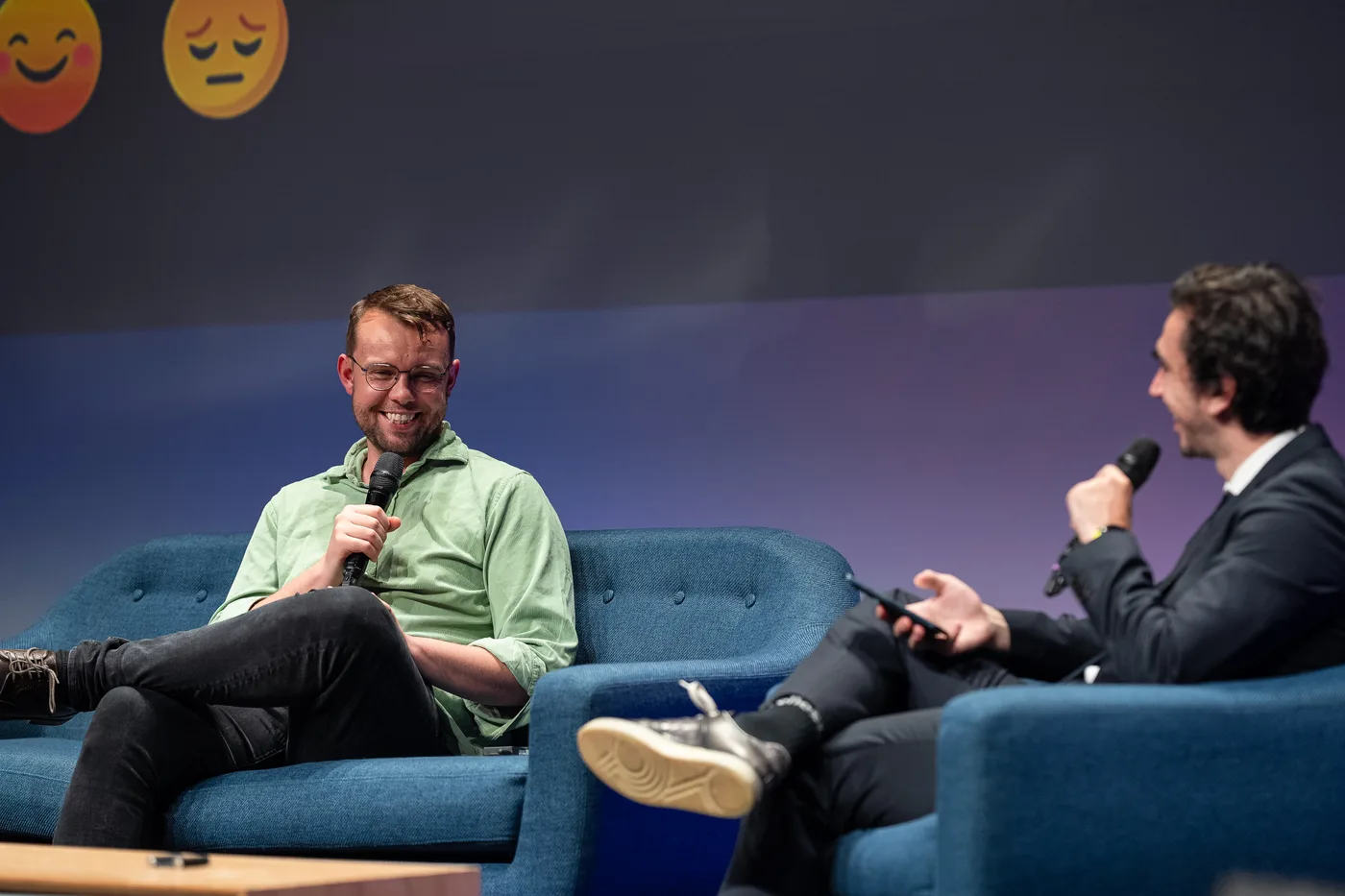 Aaron laughing with an interviewer during an AI Accelerator Institute fireside conversation
